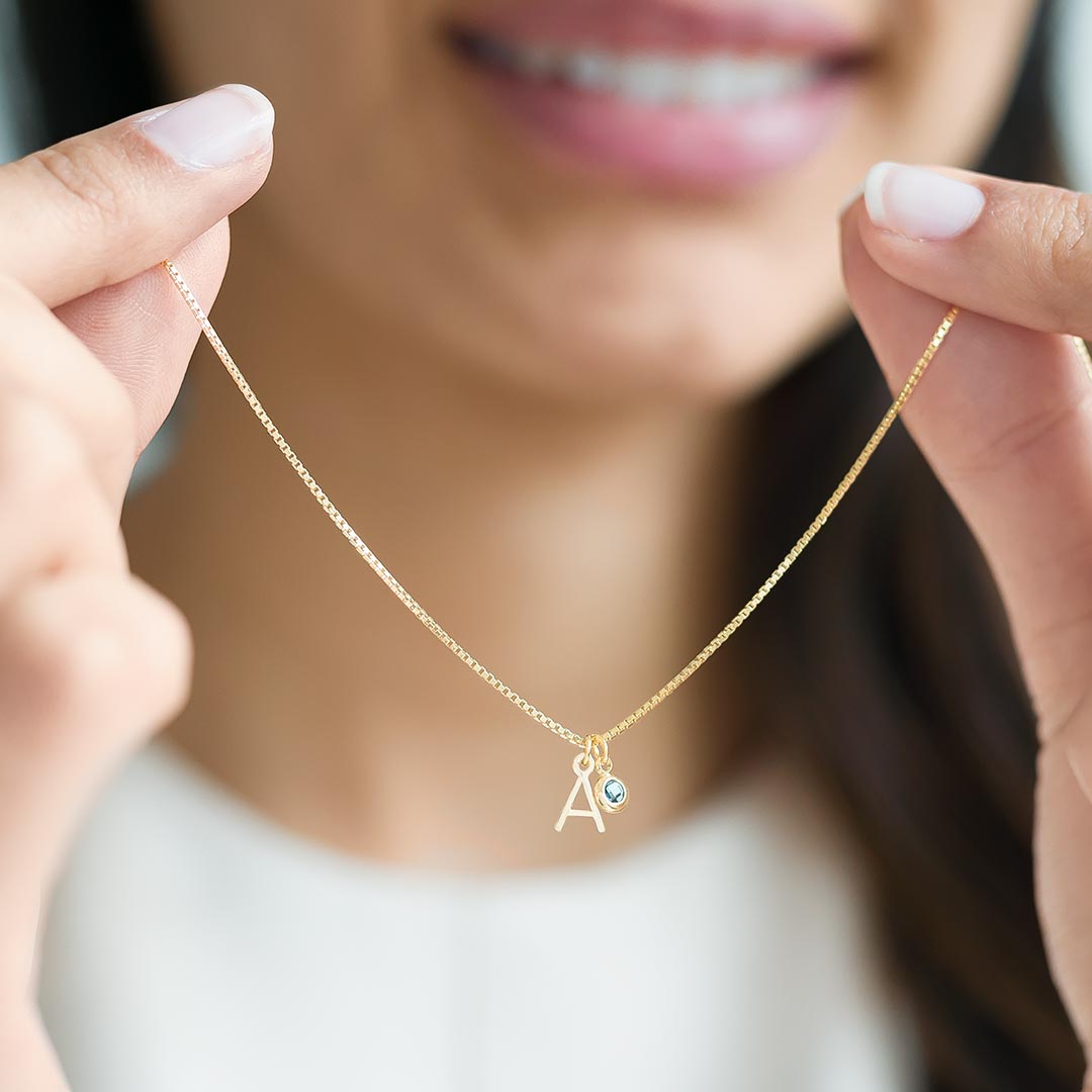 Add a Personal Touch with the Mini Letter and Birthstone Personalised Necklace in Gold Plated Sterling Silver, featuring an A Initial and March Birthstone